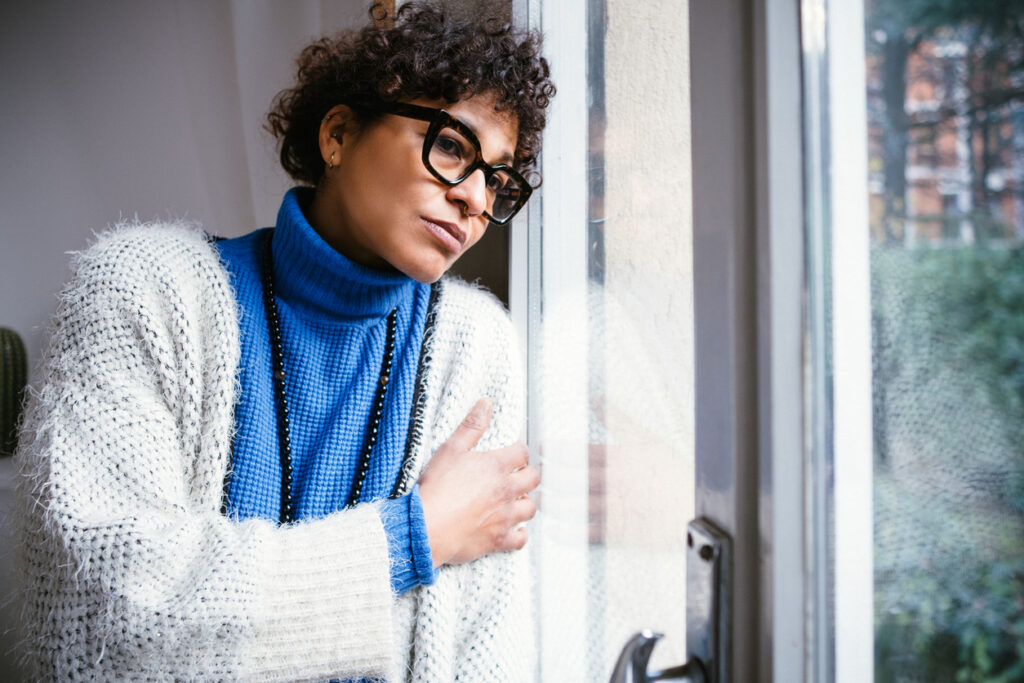 Woman looking out of a window